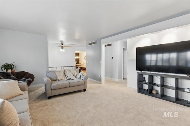 4320 N Locust Grv, Meridian, ID 83642 - living room with visible vents, carpet flooring, and a ceiling fan