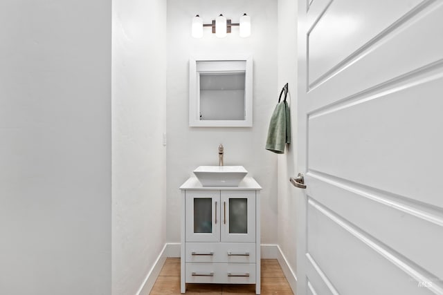 bathroom with wood-type flooring and vanity