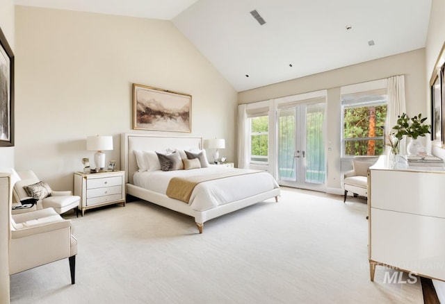 carpeted bedroom featuring french doors, access to exterior, and vaulted ceiling