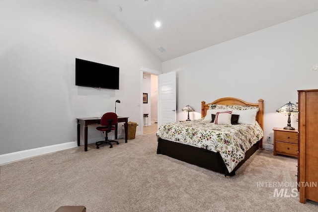 bedroom featuring high vaulted ceiling and light carpet