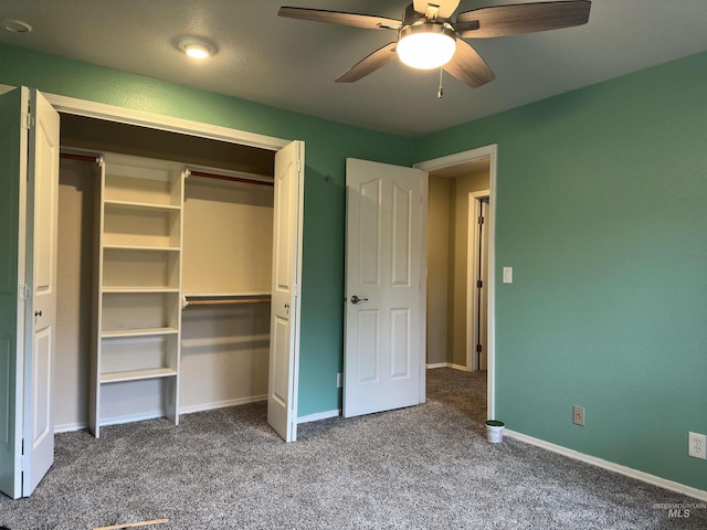 unfurnished bedroom featuring carpet floors, a closet, and ceiling fan