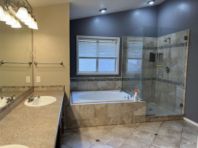 bathroom with plus walk in shower, tile patterned flooring, and vanity