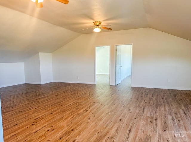 additional living space featuring ceiling fan, lofted ceiling, and light wood-type flooring