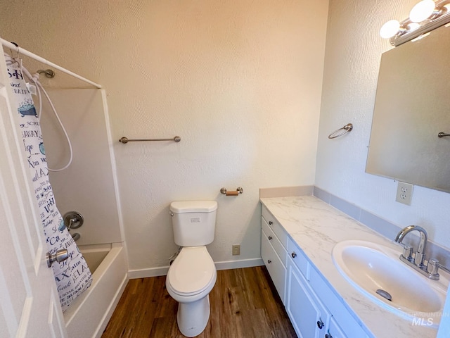 full bathroom with shower / tub combo with curtain, vanity, toilet, and hardwood / wood-style floors