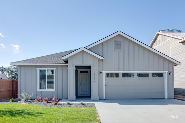 view of front of house with a garage and a front yard