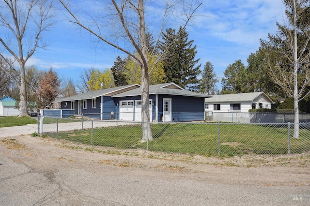 ranch-style home with a fenced front yard, an attached garage, driveway, and a front lawn