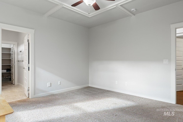 spare room with carpet floors and ceiling fan