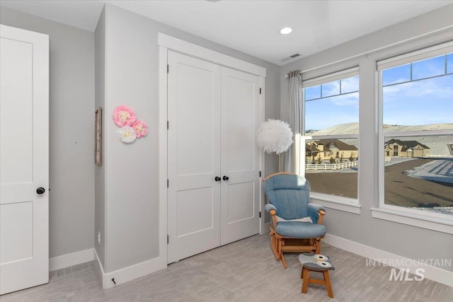 sitting room featuring baseboards and visible vents