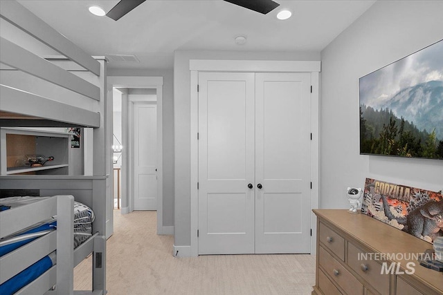 bedroom featuring recessed lighting, light carpet, visible vents, baseboards, and a closet