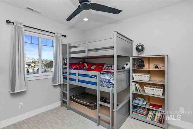 carpeted bedroom featuring visible vents, ceiling fan, and baseboards