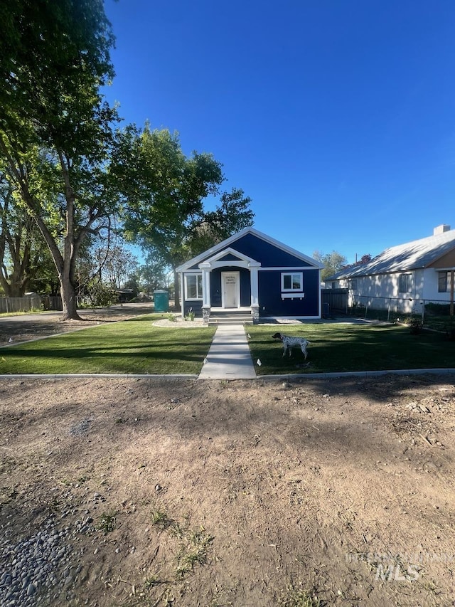 ranch-style home with a front lawn