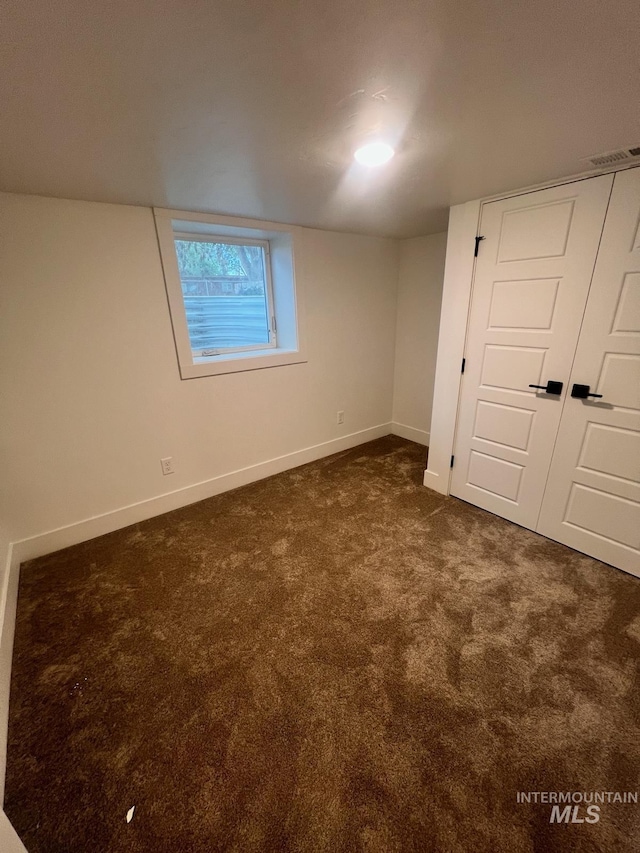 interior space with dark carpet