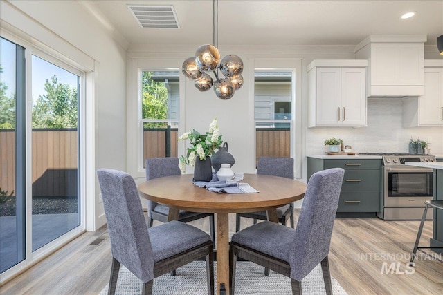 375 N Sauer River Ln, Eagle, ID 83616 - dining area featuring light wood-type flooring, a chandelier, and recessed lighting