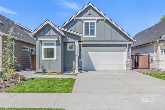 375 N Sauer River Ln, Eagle, ID 83616 - craftsman house with board and batten siding, concrete driveway, fence, a garage, and stone siding