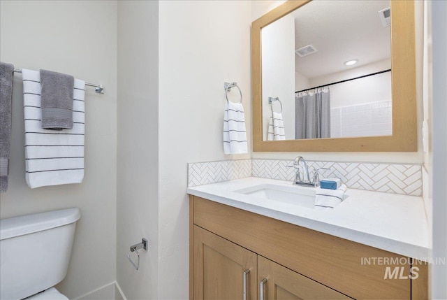 375 N Sauer River Ln, Eagle, ID 83616 - full bathroom featuring decorative backsplash, toilet, and vanity