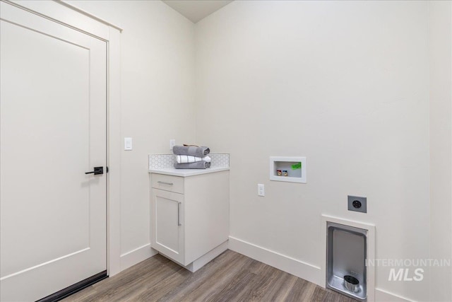 375 N Sauer River Ln, Eagle, ID 83616 - laundry area with hookup for an electric dryer, light wood-style flooring, hookup for a washing machine, and baseboards