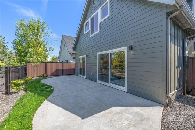 375 N Sauer River Ln, Eagle, ID 83616 - back of property featuring a patio area and a fenced backyard