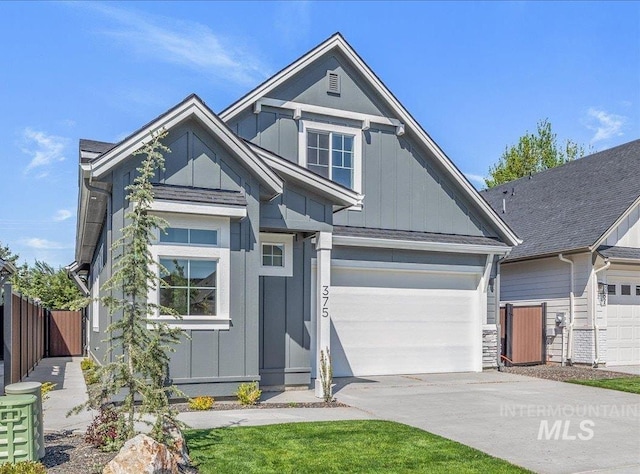 375 N Sauer River Ln, Eagle, ID 83616 - view of front of house with board and batten siding, fence, and driveway