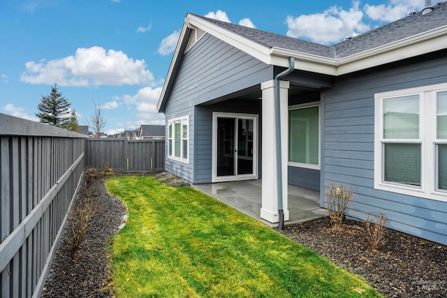 exterior space with a lawn and a patio area