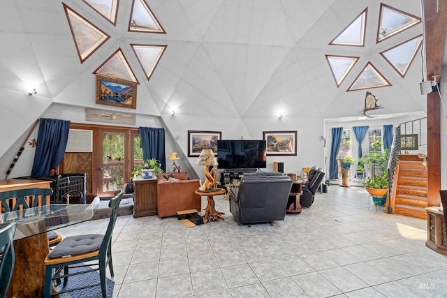 tiled living room featuring a high ceiling