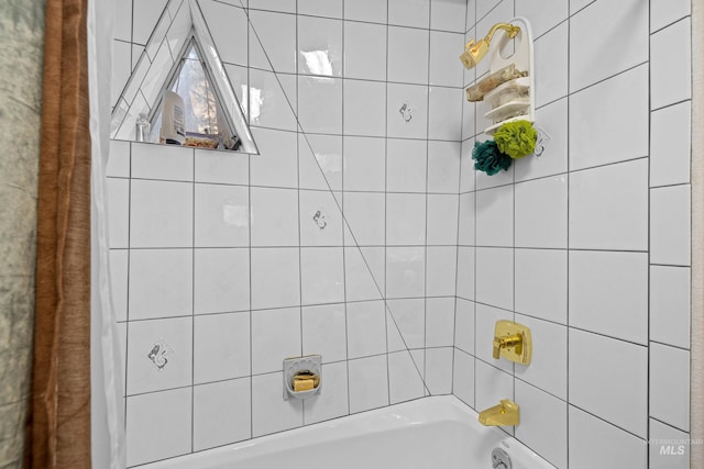 bathroom with shower / bath combination with curtain