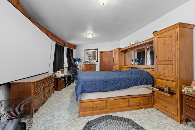 bedroom with light tile patterned floors