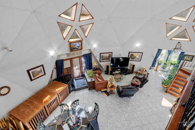 tiled living room with a high ceiling