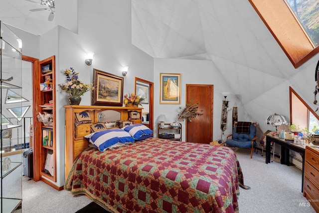 carpeted bedroom featuring ceiling fan and vaulted ceiling