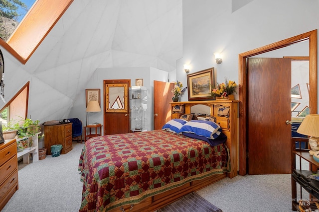 carpeted bedroom with vaulted ceiling