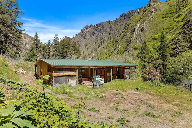 view of outdoor structure featuring a mountain view