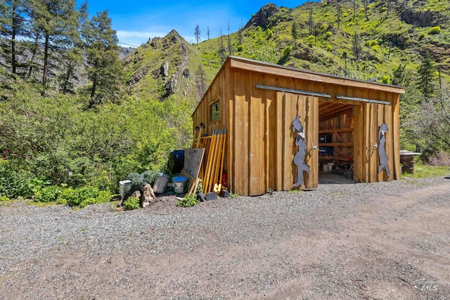 view of outbuilding featuring a mountain view