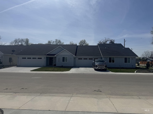 9585 W Sussex, Boise, ID 83704 - ranch-style house featuring board and batten siding, an attached garage, a front lawn, and concrete driveway