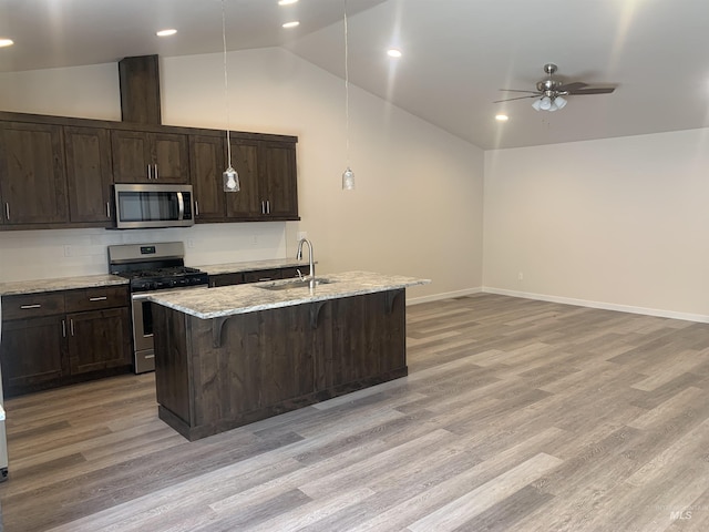 9585 W Sussex, Boise, ID 83704 - kitchen with stainless steel appliances, light wood-style floors, a sink, and lofted ceiling