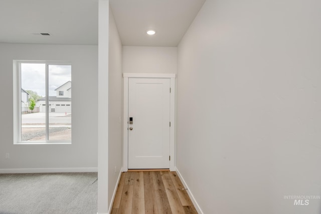 doorway to outside with light hardwood / wood-style flooring