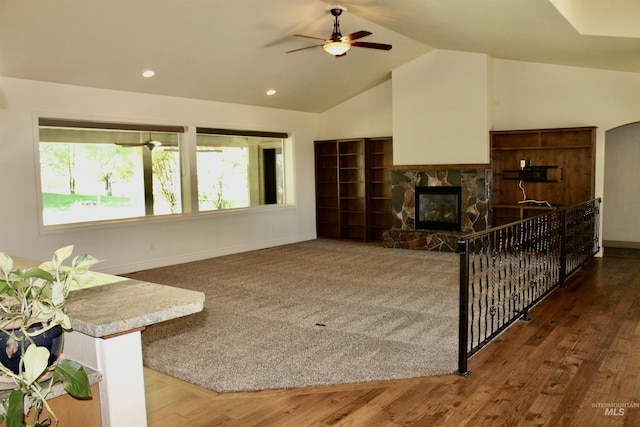 3349 E 4050 N, Twin Falls, ID 83301 - living area featuring lofted ceiling, ceiling fan, a stone fireplace, recessed lighting, and wood finished floors