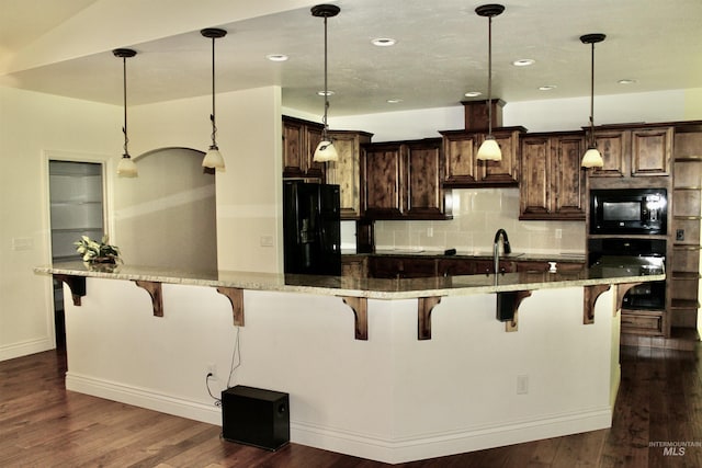 3349 E 4050 N, Twin Falls, ID 83301 - kitchen with black appliances, dark wood-style floors, decorative backsplash, pendant lighting, and recessed lighting