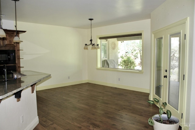 3349 E 4050 N, Twin Falls, ID 83301 - unfurnished dining area featuring dark wood-type flooring and a chandelier
