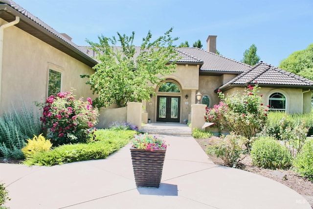 3349 E 4050 N, Twin Falls, ID 83301 - doorway to property featuring french doors, stucco siding, a chimney, and a tiled roof