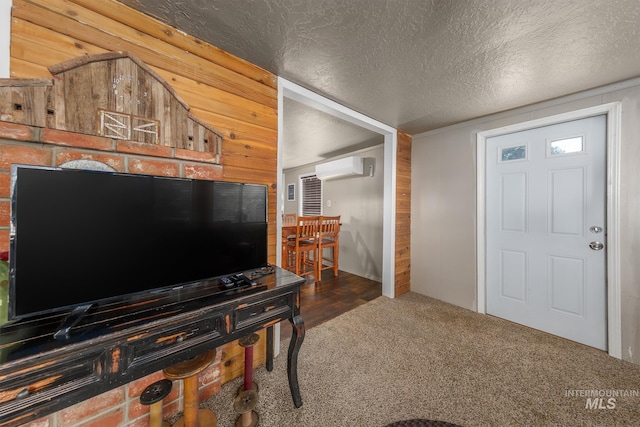 1025 W Galloway Ave, Weiser, ID 83672 - carpeted foyer with a wall unit AC, wood walls, and a textured ceiling