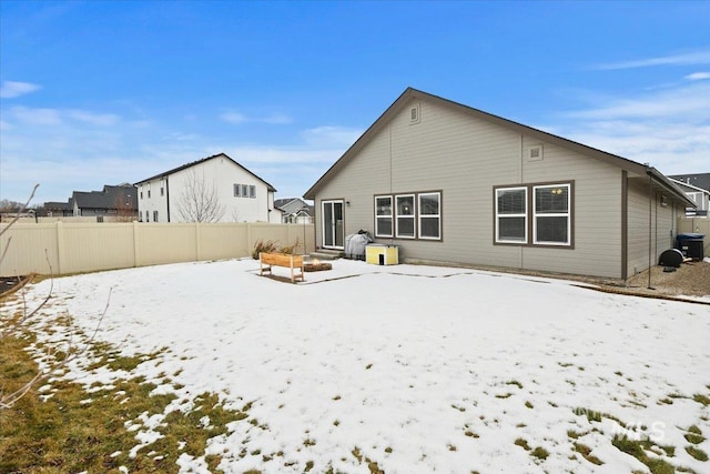 snow covered property featuring cooling unit