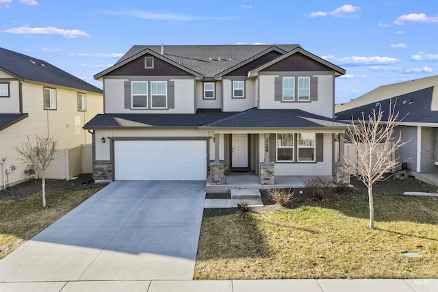 3749 E Rock Falls St, Nampa, ID 83686 - view of front facade with fence, concrete driveway, an attached garage, covered porch, and a front yard
