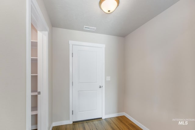 3749 E Rock Falls St, Nampa, ID 83686 - interior space featuring baseboards, wood finished floors, and visible vents