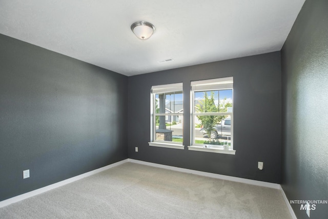 3749 E Rock Falls St, Nampa, ID 83686 - empty room with visible vents, baseboards, and carpet flooring