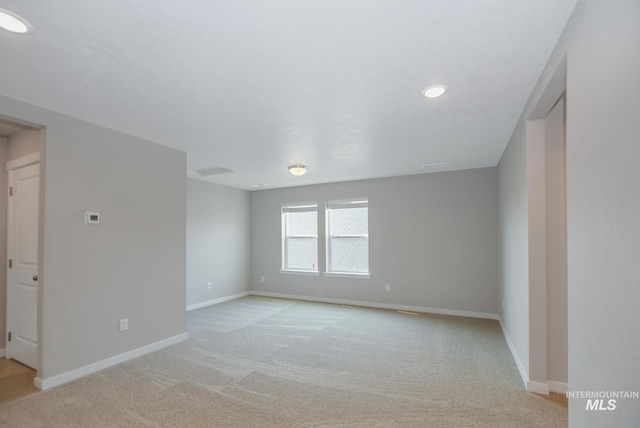 3749 E Rock Falls St, Nampa, ID 83686 - spare room with light colored carpet, baseboards, and recessed lighting
