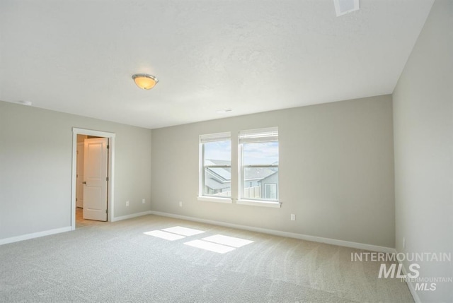 3749 E Rock Falls St, Nampa, ID 83686 - empty room featuring a textured ceiling, visible vents, baseboards, and light colored carpet