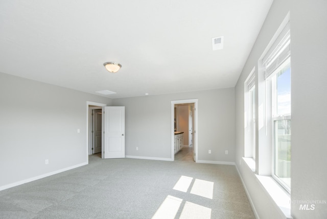 3749 E Rock Falls St, Nampa, ID 83686 - unfurnished bedroom featuring ensuite bath, light carpet, visible vents, and baseboards