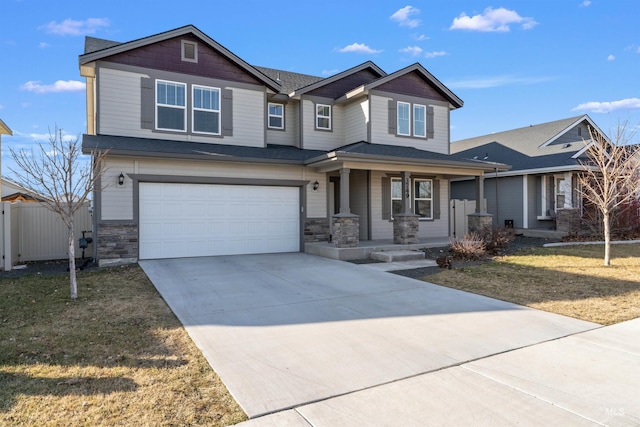 3749 E Rock Falls St, Nampa, ID 83686 - craftsman inspired home with a porch, stone siding, concrete driveway, fence, and a garage