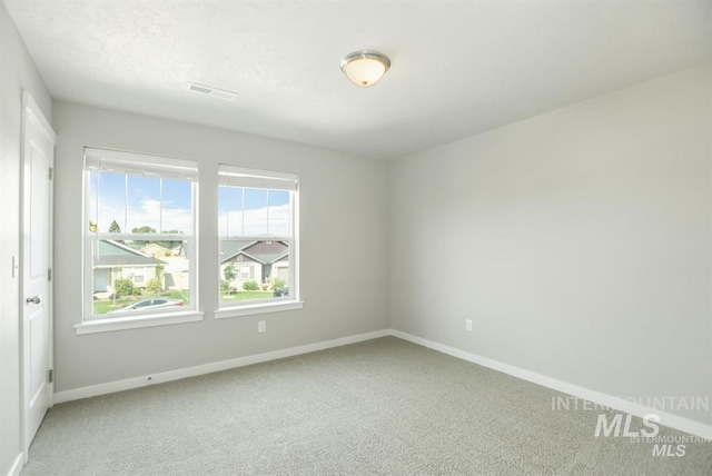 3749 E Rock Falls St, Nampa, ID 83686 - unfurnished room featuring plenty of natural light, carpet flooring, and baseboards