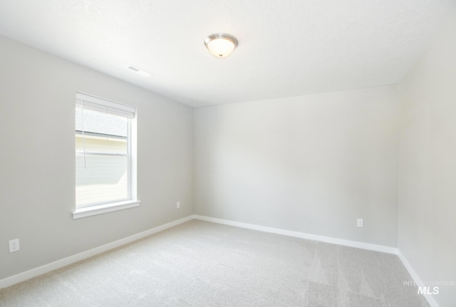 3749 E Rock Falls St, Nampa, ID 83686 - empty room featuring light colored carpet, baseboards, and visible vents