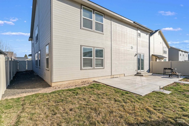3749 E Rock Falls St, Nampa, ID 83686 - back of property featuring a fenced backyard, a gate, a yard, and a patio